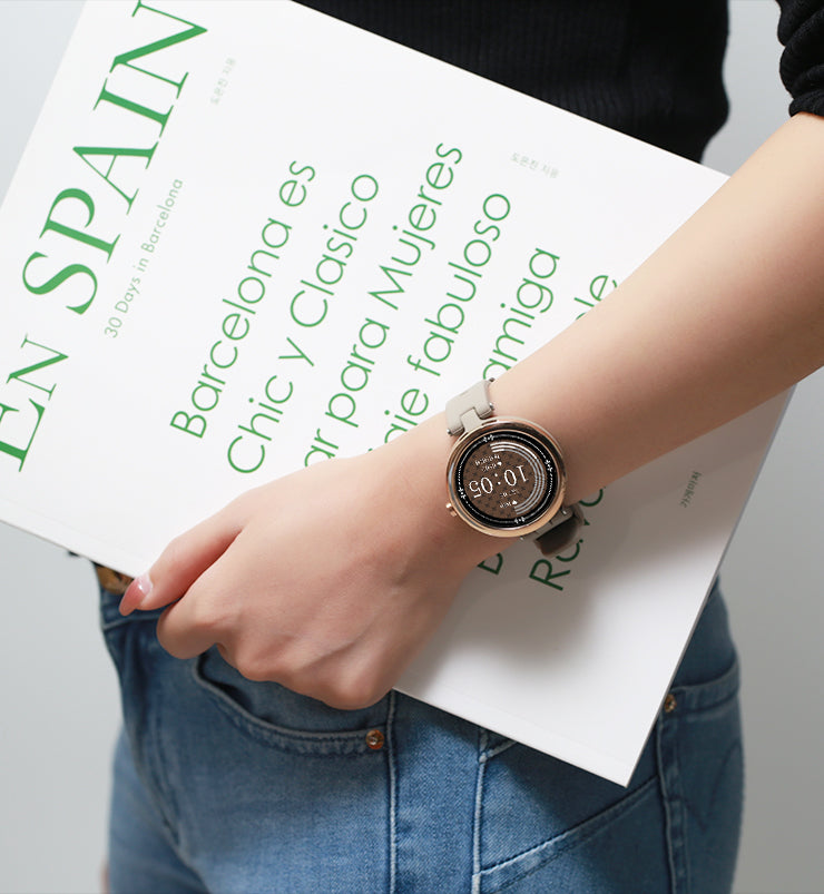 Holding booking wearing light sand gold sports watch