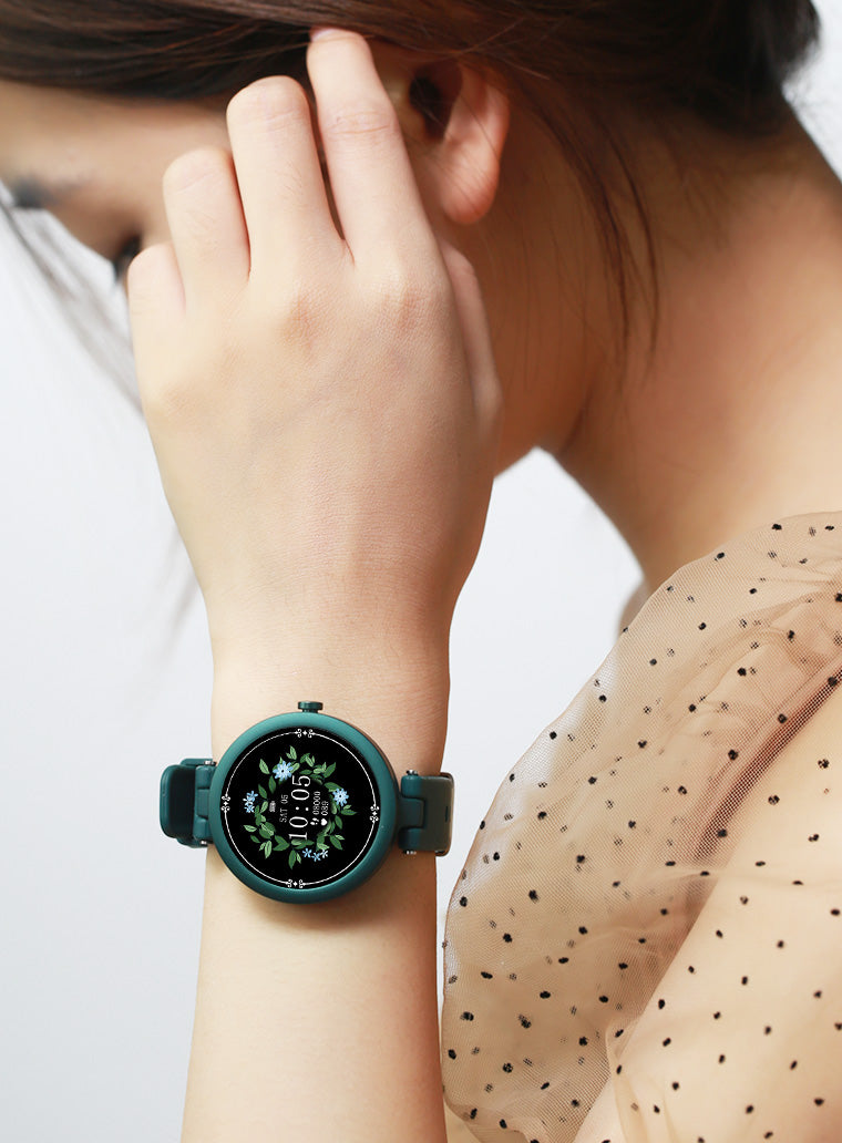 Woman Brushing Hair Back Wearing Olive Green Sports Smart Watch